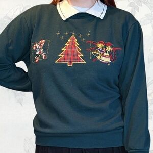 Festive Green Sweater with Holiday Motifs